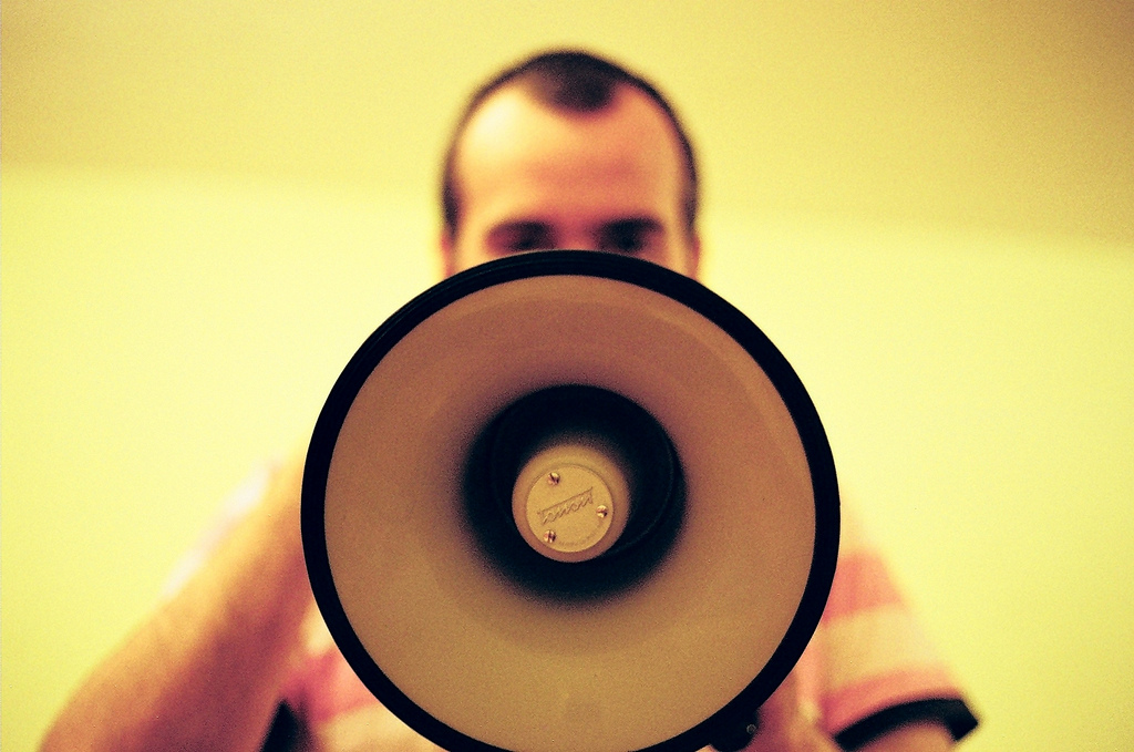 photo, holding a megaphone